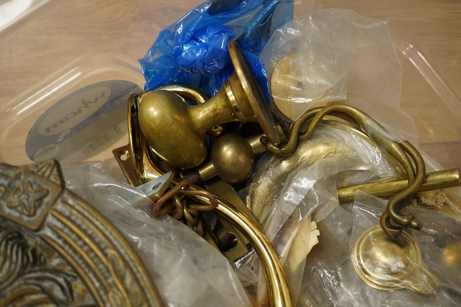 A collection of brass fittings to include lions-head door-knocker and various handles and hinges. Condition - varies